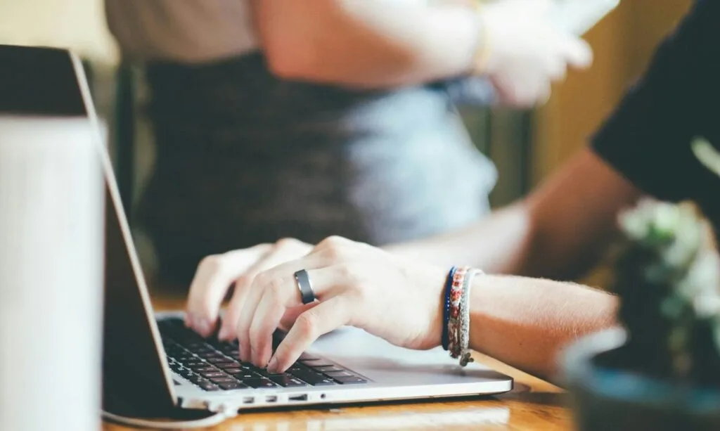 Photo by Pixabay Close-up of hands typing on a laptop with a blurred background.